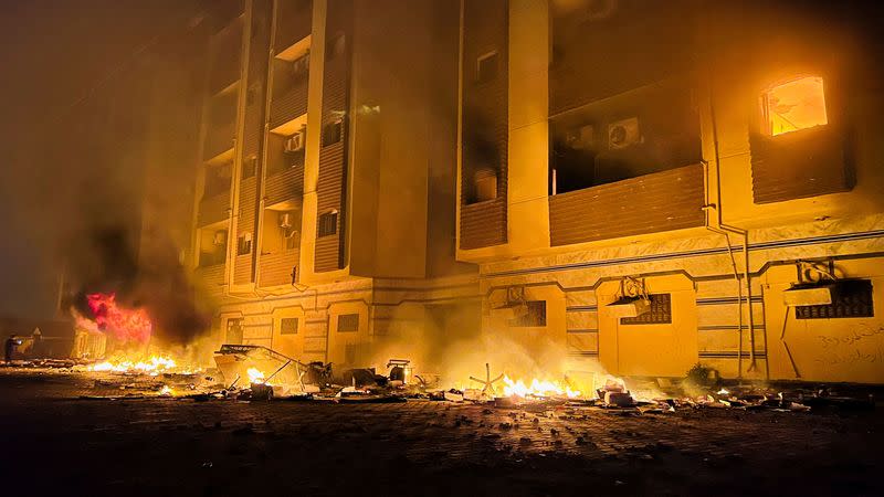 A view shows fire burning inside the Libyan parliament building after protests against the failure of the government, in Tobruk