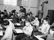 <p>Education of the Japanese evacuee children at the Granada, Colorado on Feb. 23, 1943. Relocation Center, is being carried on uninterruptedly in the community of 7,000 persons. The school system has 35 caucasian teachers whos salaries are from $1,260 to $2,000. The other are Japanese get the top war Relocation Authority $19 a month. Fuji Katayama, a Japanese teachers, is shown instructing her fourth grade class at the center. Mrs. Katayama is a University of California at Los Angeles graduate with a major in psychology.) (AP Photo/WAB) </p>
