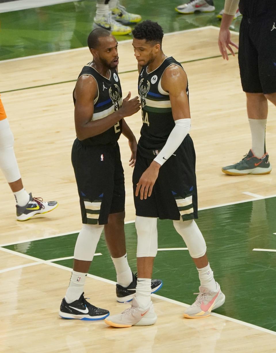 Milwaukee Bucks forward Khris Middleton (22) and Milwaukee Bucks forward Giannis Antetokounmpo (34) talk during the third quarter of Game 6 of the NBA Finals at Fiserv Forum in Milwaukee on Tuesday, July 20, 2021.