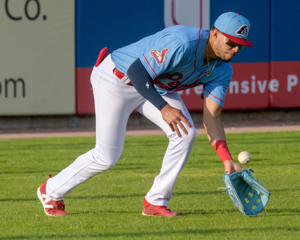 Peoria Chiefs outfielder Joshua Baez fields a hit to left field during a game against the Michigan Whitecaps on Wednesday, May 15, 2024 at Dozer Park in Peoria.