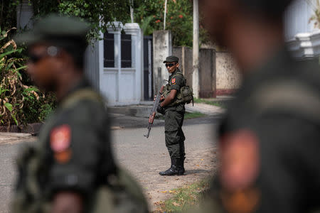 Soldiers stand guard outside St. Sebastian Church, days after a string of suicide bomb attacks across the island on Easter Sunday, in Negombo, Sri Lanka, May 1, 2019. REUTERS/Danish Siddiqui