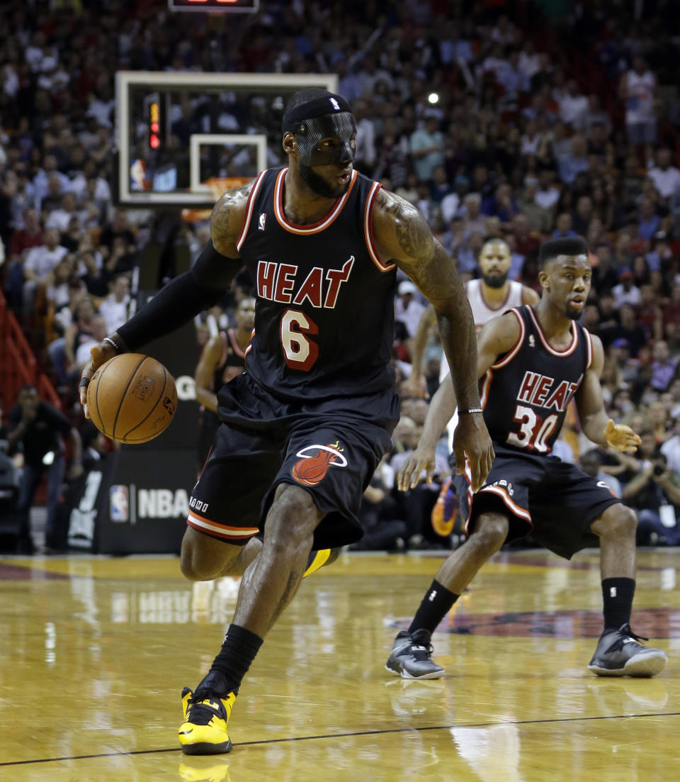 Miami Heat small forward LeBron James (6) drives against the New York Knicks during the first half of an NBA basketball game in Miami, Thursday, Feb. 27, 2014. (AP Photo/Alan Diaz)