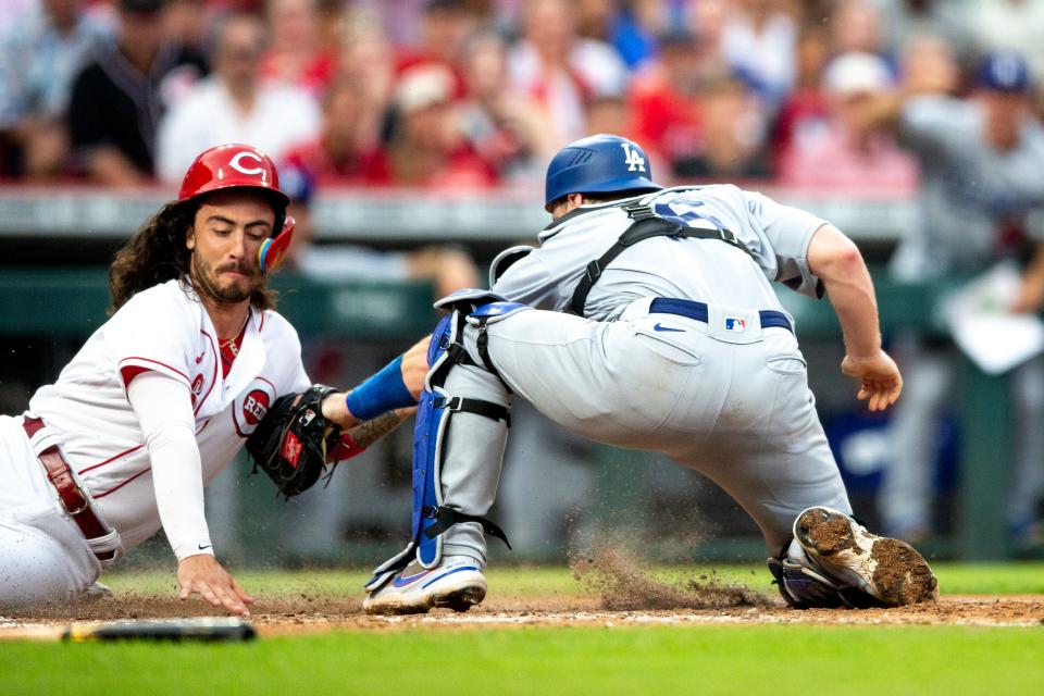 Los Angeles Dodgers catcher Will Smith (16) tags out Cincinnati Reds second baseman Jonathan India (6) in the fifth inning of the MLB game between the Cincinnati Reds and the Los Angeles Dodgers in Cincinnati at Great American Ball Park on Wednesday, June 22, 2022. 