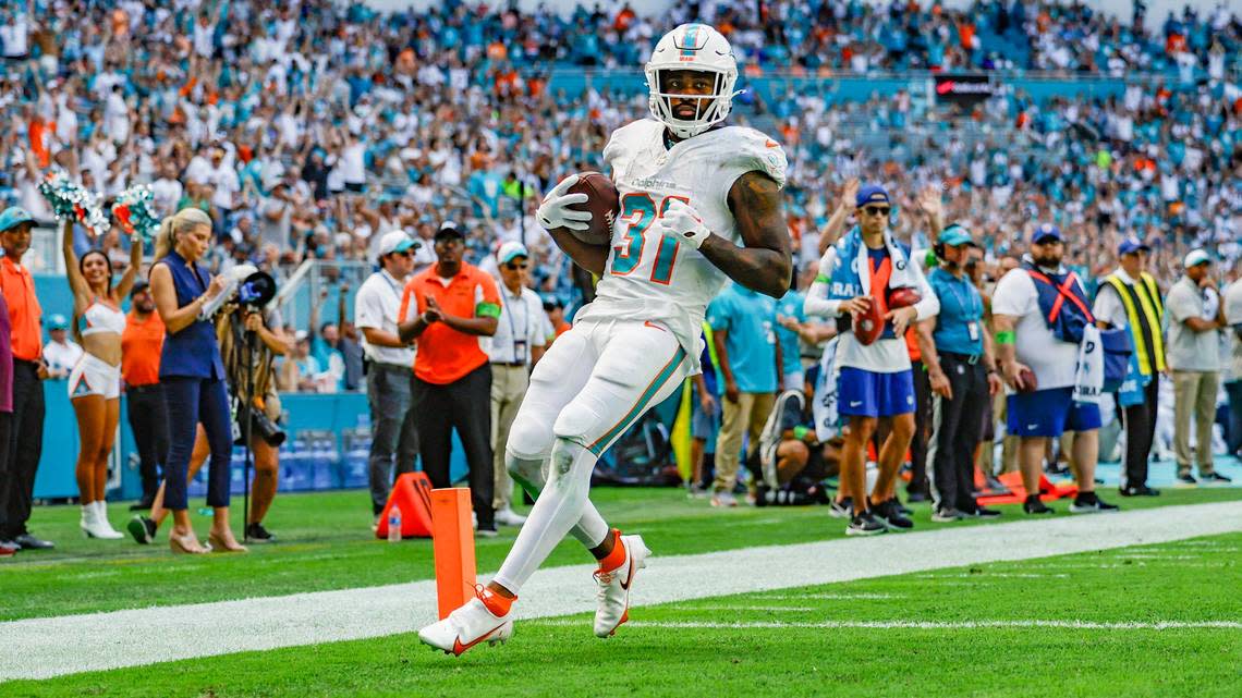 Miami Dolphins running back Raheem Mostert (31) scores in the second quarter against the Carolina Panthers at Hard Rock Stadium in Miami Gardens on Sunday, October 15, 2023.