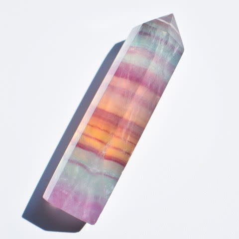 <p>Getty</p> Crystal Healing, rainbow fluorite tower, banded fluorite crystal