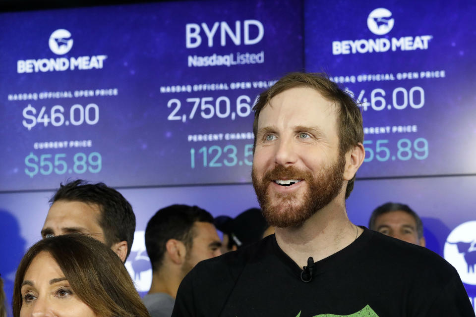 FILE - In this May 2, 2019, file photo Beyond Meat CEO Ethan Brown watches as his company's stock begins to trade following its IPO at Nasdaq in New York. Beyond Meat reports financial earns Monday, Oct. 28. (AP Photo/Mark Lennihan, File)