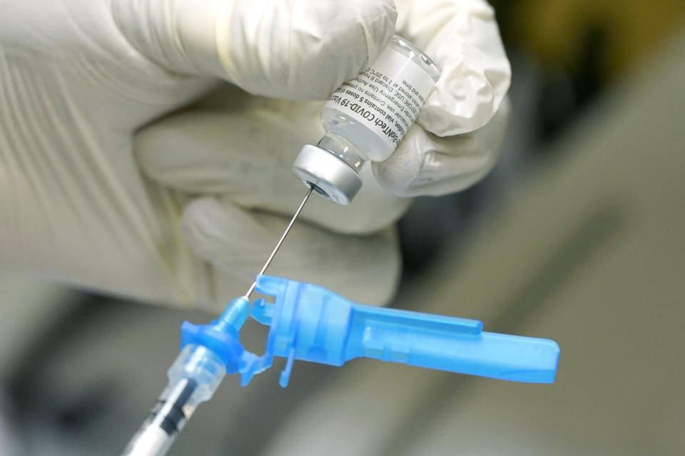 FILE - In this Dec. 16, 2020, file photo, a registered nurse prepares a syringe with the first round of the Pfizer COVID vaccination in Ridgeland, Miss., as state medical leaders received inoculations. On Friday, Dec. 18, 2020, The coronavirus vaccines have been rolled out unevenly across the U.S., but some states in the Deep South have had particularly dismal inoculation rates. (AP Photo/Rogelio V. Solis, File)