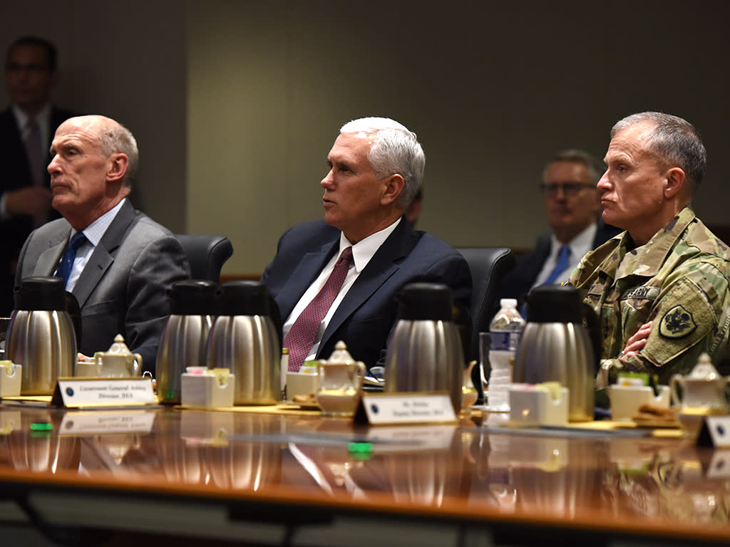 From left, Director of National Intelligence Dan Coats, Vice President Mike Pence and Defense Intelligence Agency Director Lt. Gen. Robert Ashley listen to an intelligence brief during the Vice President€'s visit to DIA headquarters Nov. 6, at Joint Base Anacostia-Bolling in Washington, D.C. (Photo: DIA Public Affairs)