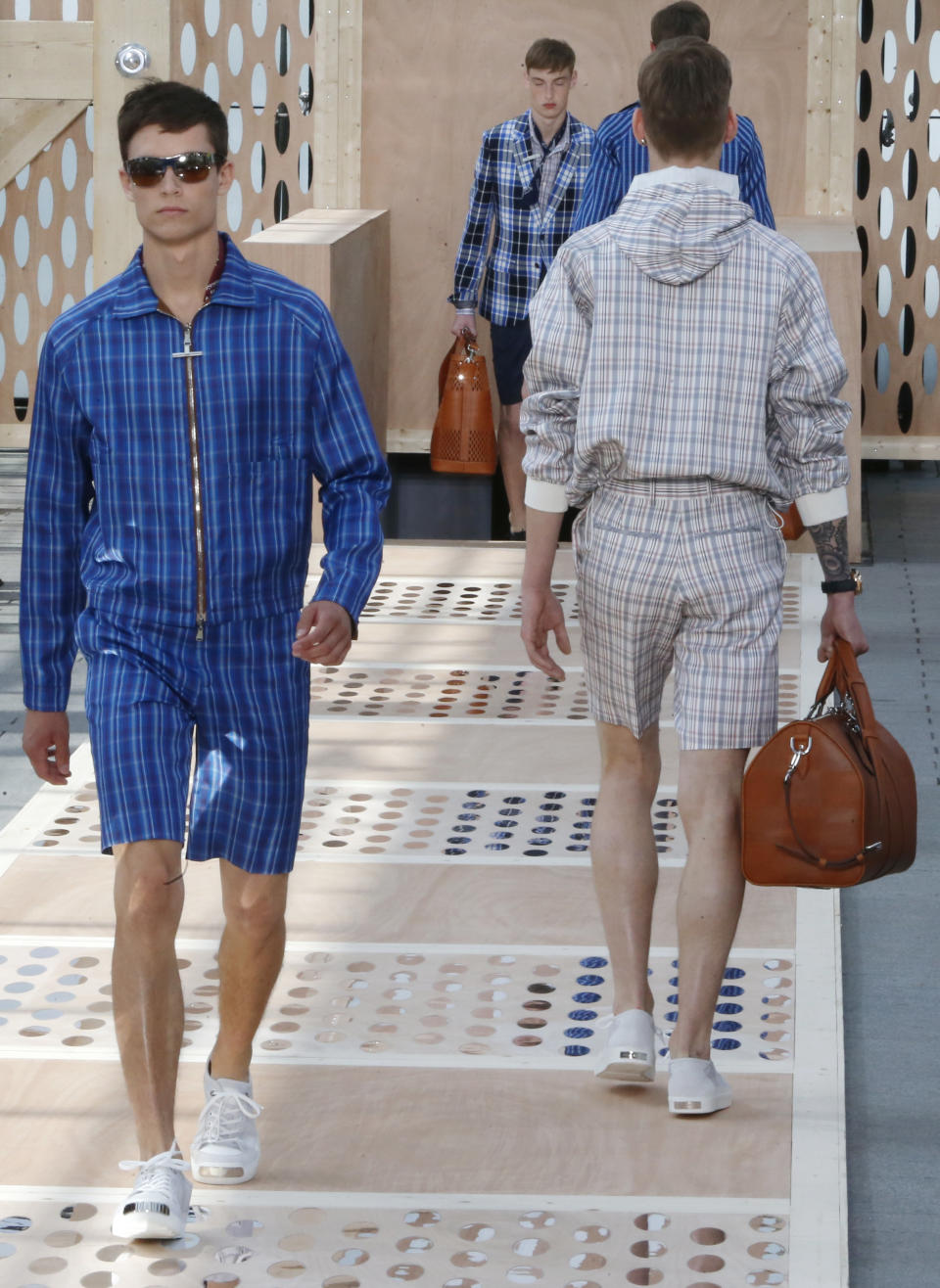 Models wear creations by British fashion designer Kim Jones for Louis Vuitton's Spring-Summer 2014 men's collection presented Thursday, June 27, 2013 in Paris. (AP Photo/Jacques Brinon)