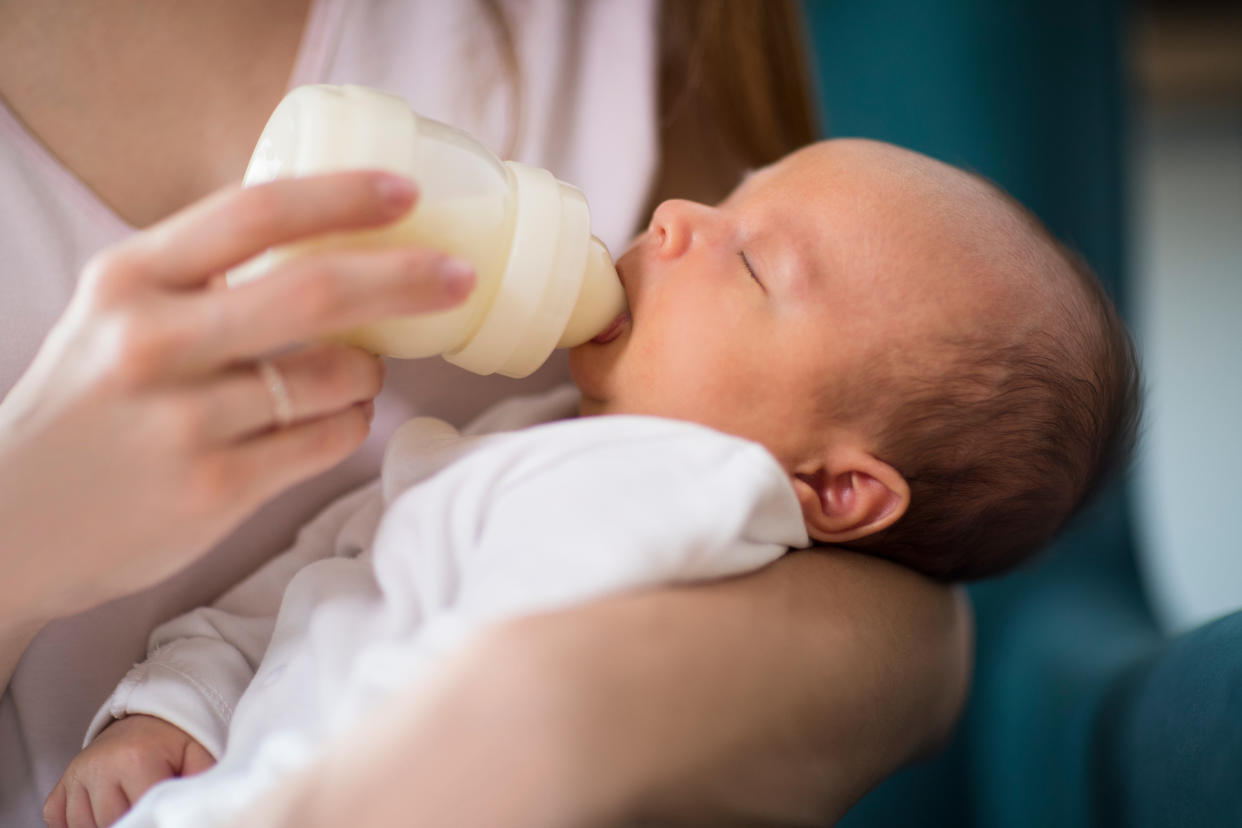 A baby being bottle-fed milk. (PHOTO: Getty Images)