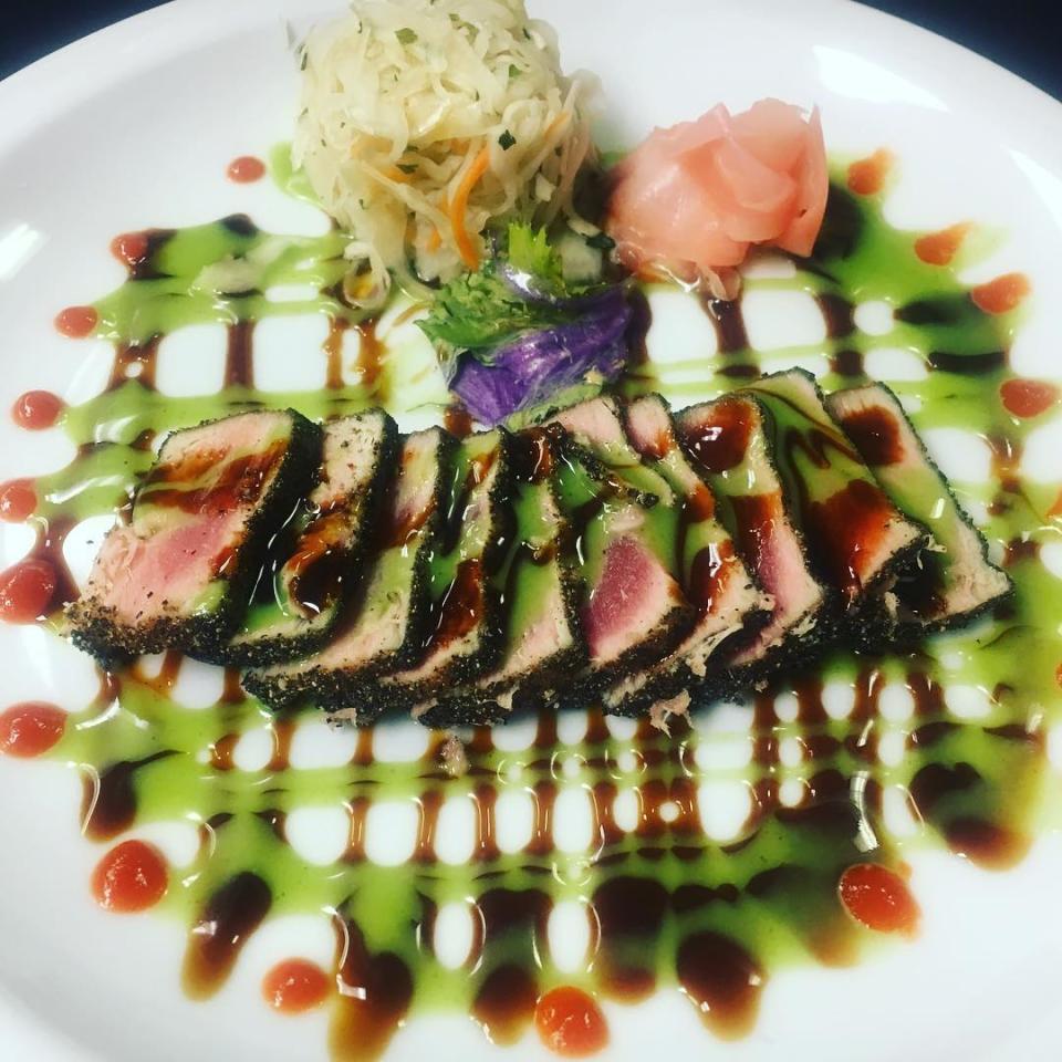 At MJ's Restaurant, Bar & Grille in the Bayville section of Berkeley Township, black pepper-crusted ahi tuna is served with spicy slaw. kabayaki sauce and wasabi aioli.