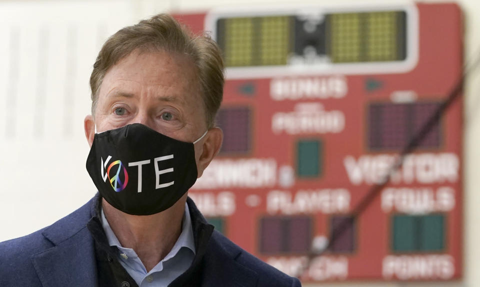 Connecticut Governor Ned Lamont prepares to cast his vote at Greenwich High School in Greenwich, Connecticut, on November 3, 2020. - The United States started voting Tuesday in an election amounting to a referendum on Donald Trump's uniquely brash and bruising presidency, which Democratic opponent and frontrunner Joe Biden urged Americans to end to restore "our democracy." (Photo by TIMOTHY A. CLARY / AFP) (Photo by TIMOTHY A. CLARY/AFP via Getty Images)