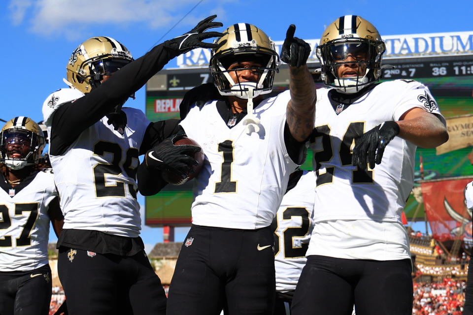 TAMPA, FLORIDA – DECEMBER 31: Alontae Taylor #1 of the New Orleans Saints celebrates with teammates after an interception during the second quarter against the Tampa Bay Buccaneers at Raymond James Stadium on December 31, 2023 in Tampa, Florida. (Photo by Mike Ehrmann/Getty Images)