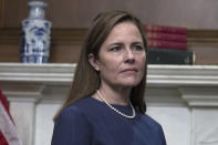 Judge Amy Coney Barrett, President Donald Trump's nominee to the Supreme Court, meets with Sen. Mike Crapo, R-Idaho, not pictured, at the Capitol, Tuesday, Sept. 29, 2020 in Washington. (Tasos Katopodis/Pool via AP)