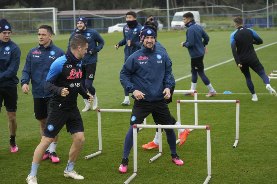 Napoli players warm up during a training session at the club headquarters in Castel Volturno, near Naples, Wednesday, April 5, 2023. Unlike other major cities in Italy, Naples has only one major soccer team and the fan support for Napoli is felt on every street and alleyway. Lobotka, who developed with Ajax’s junior squad and then played for Danish club Nordsjaelland and Spanish side Celta Vigo before transferring to Italy, had never experienced anything like Napoli. (AP Photo/Gregorio Borgia)