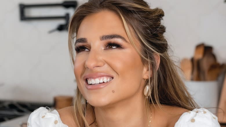 Jessie James Decker holding coffee mug in kitchen 