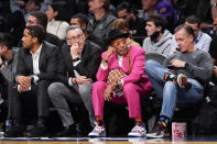 Film director Spike Lee, second from right, watches the action during the first half of an NBA basketball game between the Brooklyn Nets and the New York Knicks, Tuesday, Nov. 30, 2021, in New York. (AP Photo/Mary Altaffer)