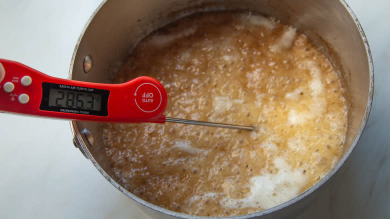 toffee mixture with candy thermometer