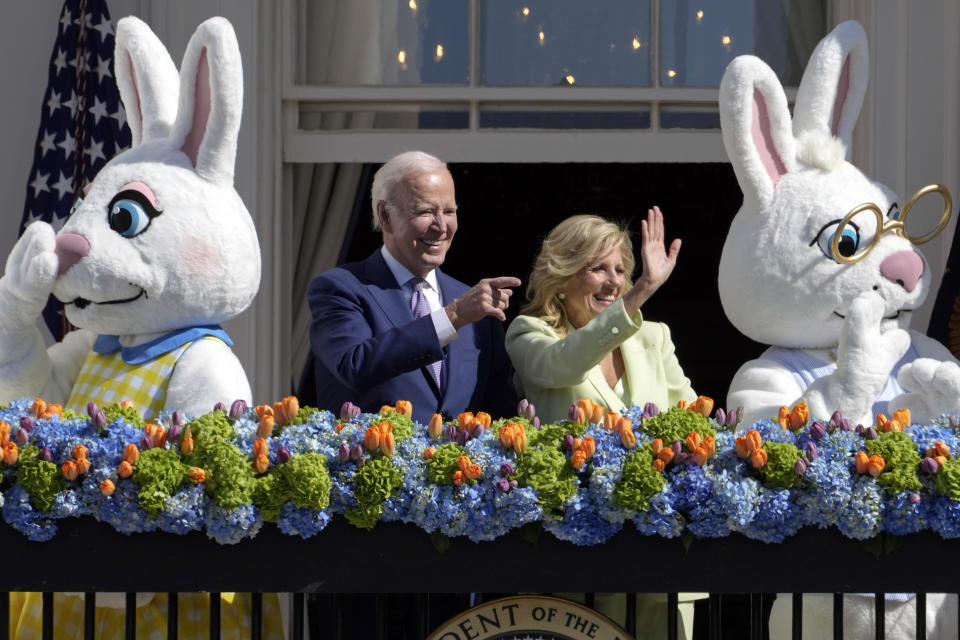 President Joe Biden stands with first lady Jill Biden on the Blue Room Balcony during the 2023 White House Easter Egg Roll, Monday, April 10, 2023, in Washington. (AP Photo/Susan Walsh)