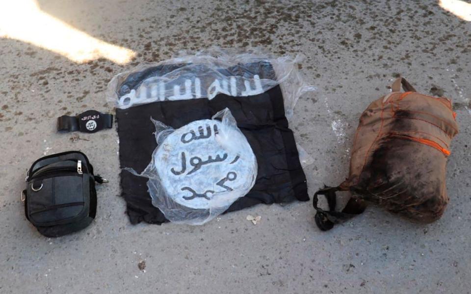 Possessions belonging to Islamic State fighters captured by Syrian Democratic Forces at Gweiran prison on Friday - SDF via AP