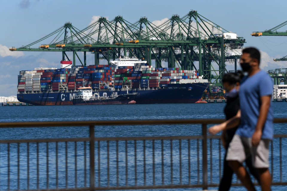 A container vessel is docked at the port in Singapore on July 16, 2020. - Singapore's economy shrank more than 40 percent in the second quarter as the coronavirus plunged the Southeast Asian financial hub into recession for the first time in more than a decade, official data showed July 14. (Photo by Roslan RAHMAN / AFP) (Photo by ROSLAN RAHMAN/AFP via Getty Images)