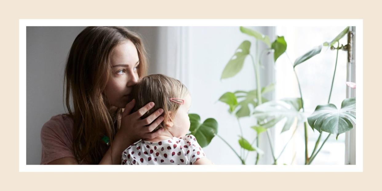 Mother's Day - mom holding baby and kissing baby's head