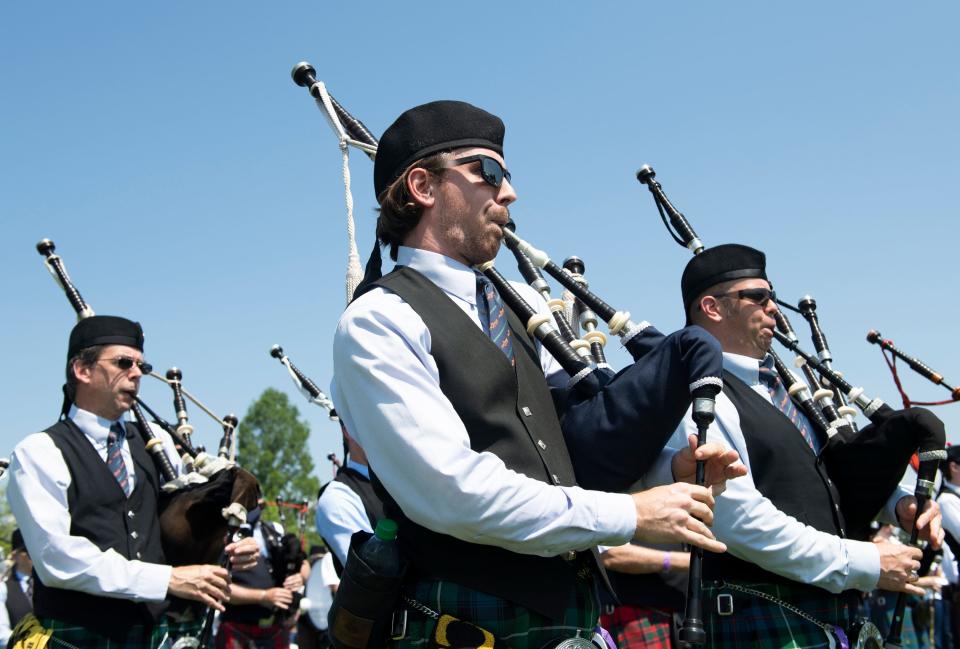 Kyle Splane (center), from Knoxville Pipes and Drums, marches in the military tribute during the Greenville Scottish Games held at Furman University Saturday, May 25, 2019.