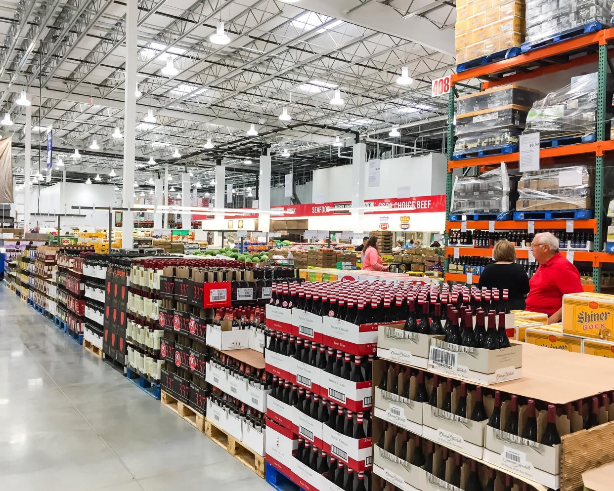 aisle of bottles in wine section of Costco store