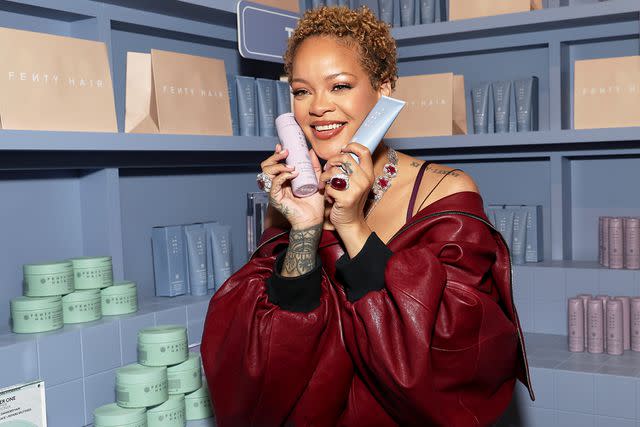 <p>Kevin Mazur/Getty</p> Rihanna teases Fenty Hair products