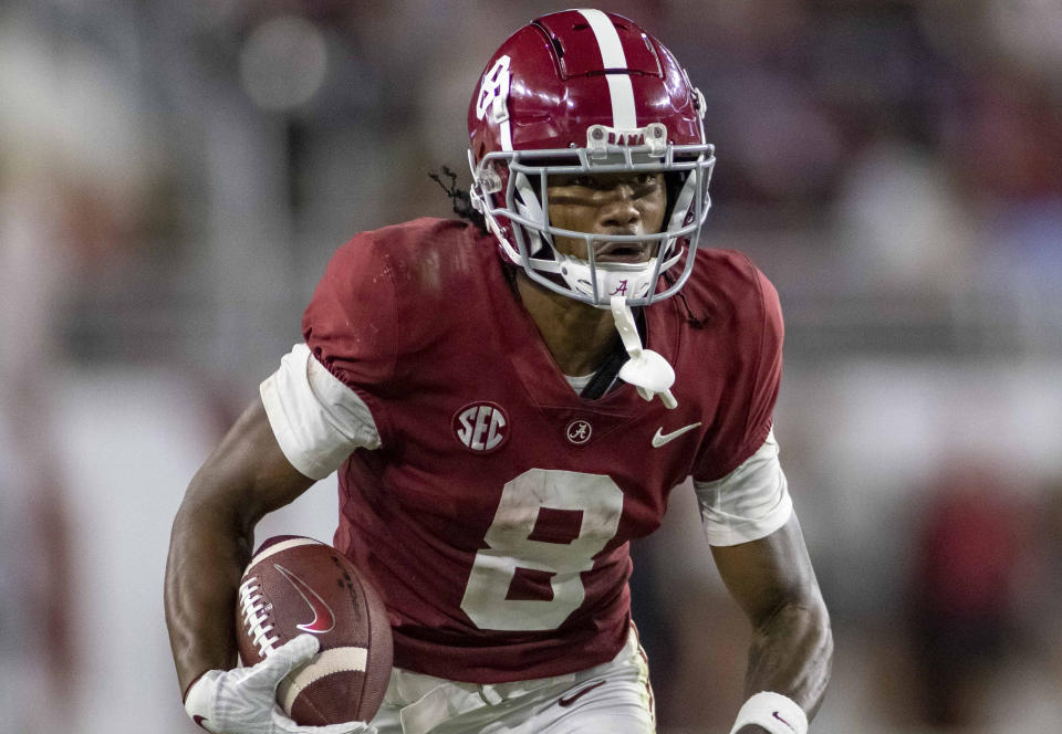 FILE - Alabama wide receiver John Metchie III runs during the second half of an NCAA college football game, on Oct. 23, 2021, in Tuscaloosa, Ala. The Houston Texans rookie wide receiver announced Sunday, July 24, 2022, that he has been diagnosed with a form of leukemia. (AP Photo/Vasha Hunt, File)