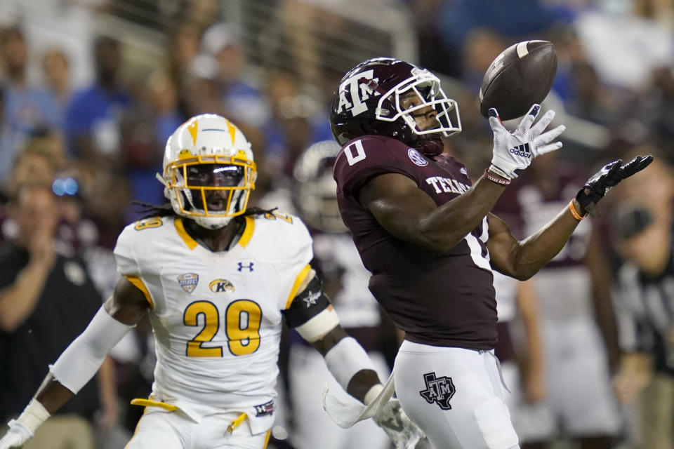 Texas A&M wide receiver Ainias Smith (0) juggles the ball before making a first down catch against Kent State safety C.J. Holmes (29) during the first half of an NCAA college football game on Saturday, Sept. 4, 2021, in College Station, Texas. (AP Photo/Sam Craft)