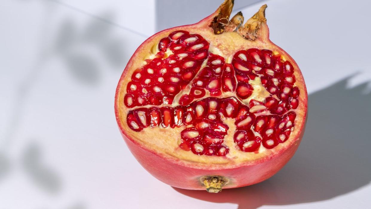 pomegranate slice on white background
