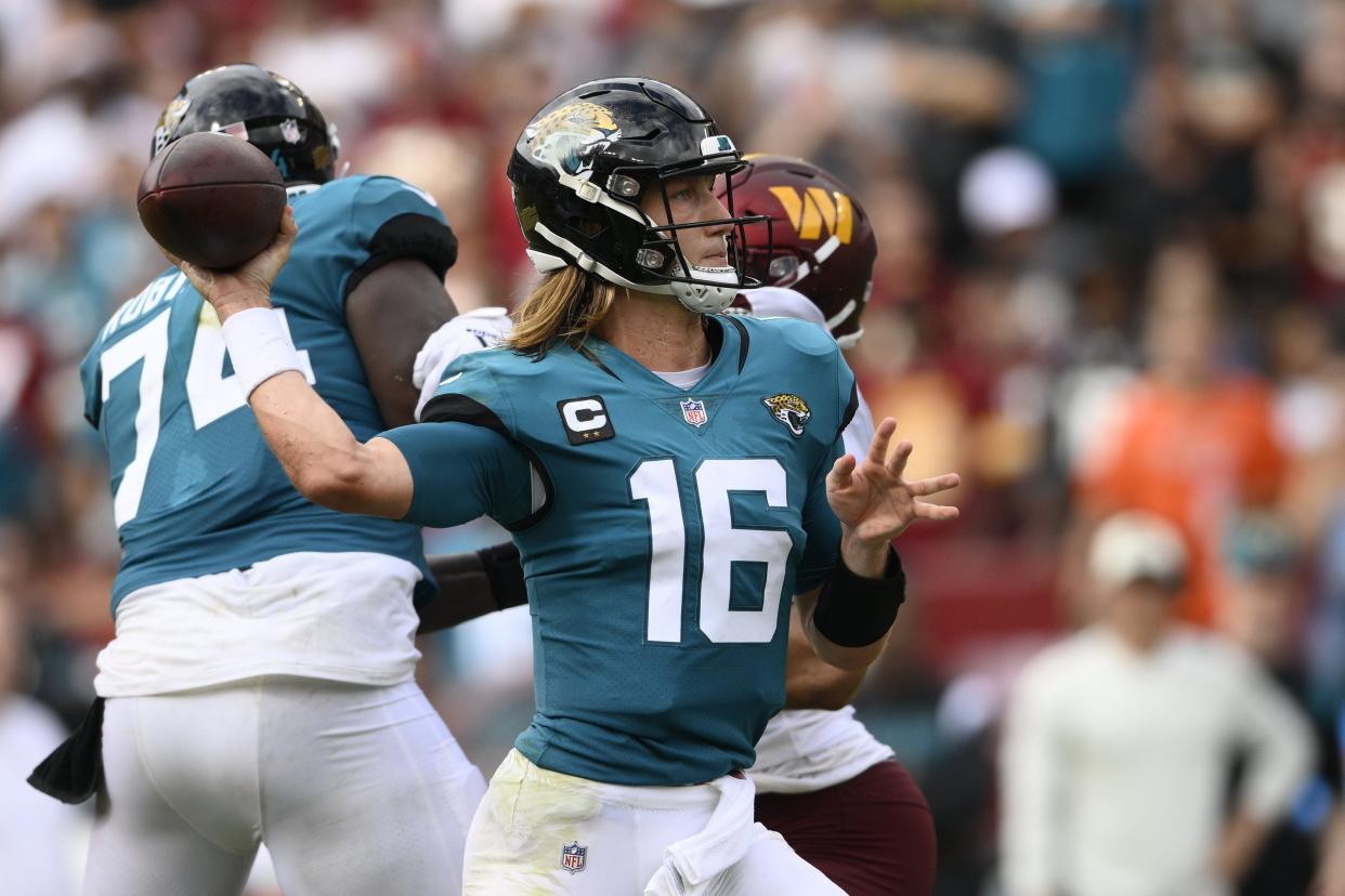 Jacksonville Jaguars quarterback Trevor Lawrence (16) in action during the second half of a NFL football game against the Washington Commanders, Sunday, Sept. 11, 2022, in Landover, Md. (AP Photo/Nick Wass)