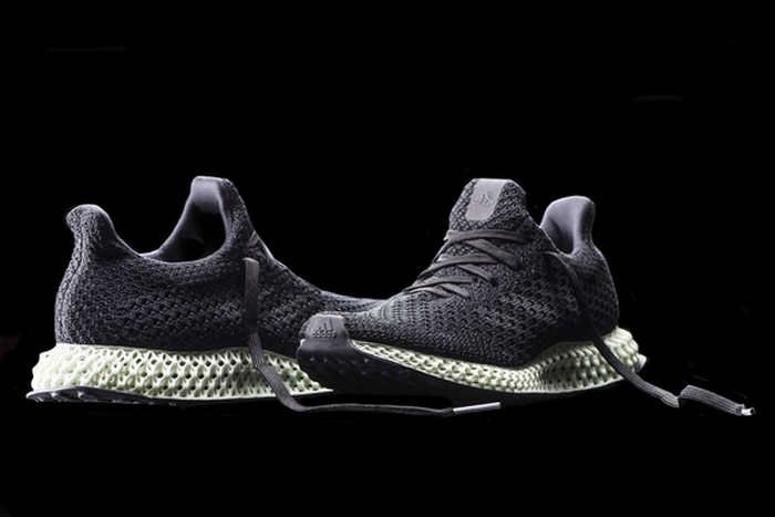 TA pair of running shoes -- concept for adidas' Futurecraft 4D shoes with 3D-printed midsoles.