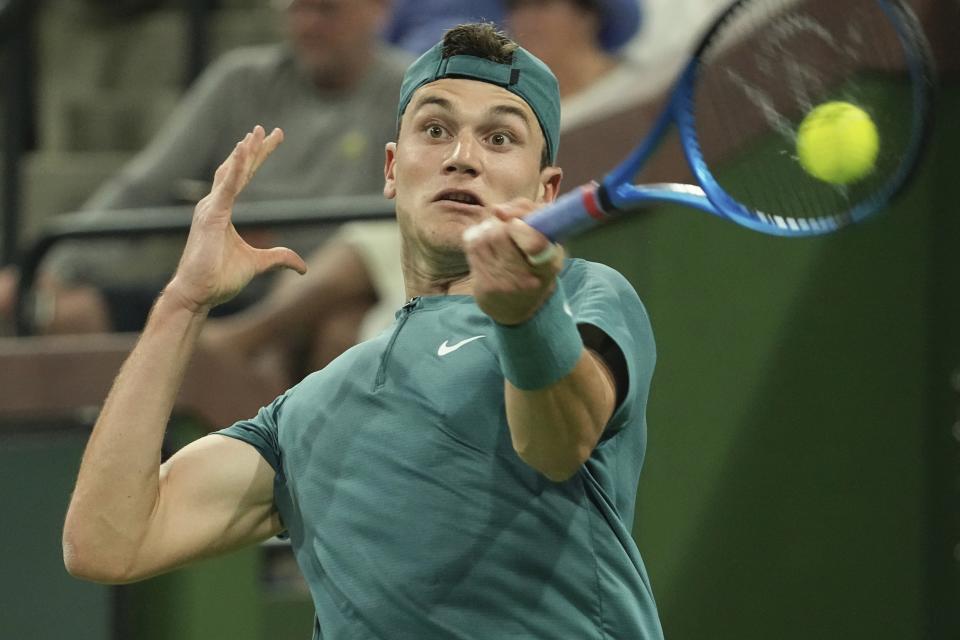 Jack Draper, of Britain, returns a shot to Andy Murray, of Britain, at the BNP Paribas Open tennis tournament Monday, March 13, 2023, in Indian Wells, Calif. (AP Photo/Mark J. Terrill)