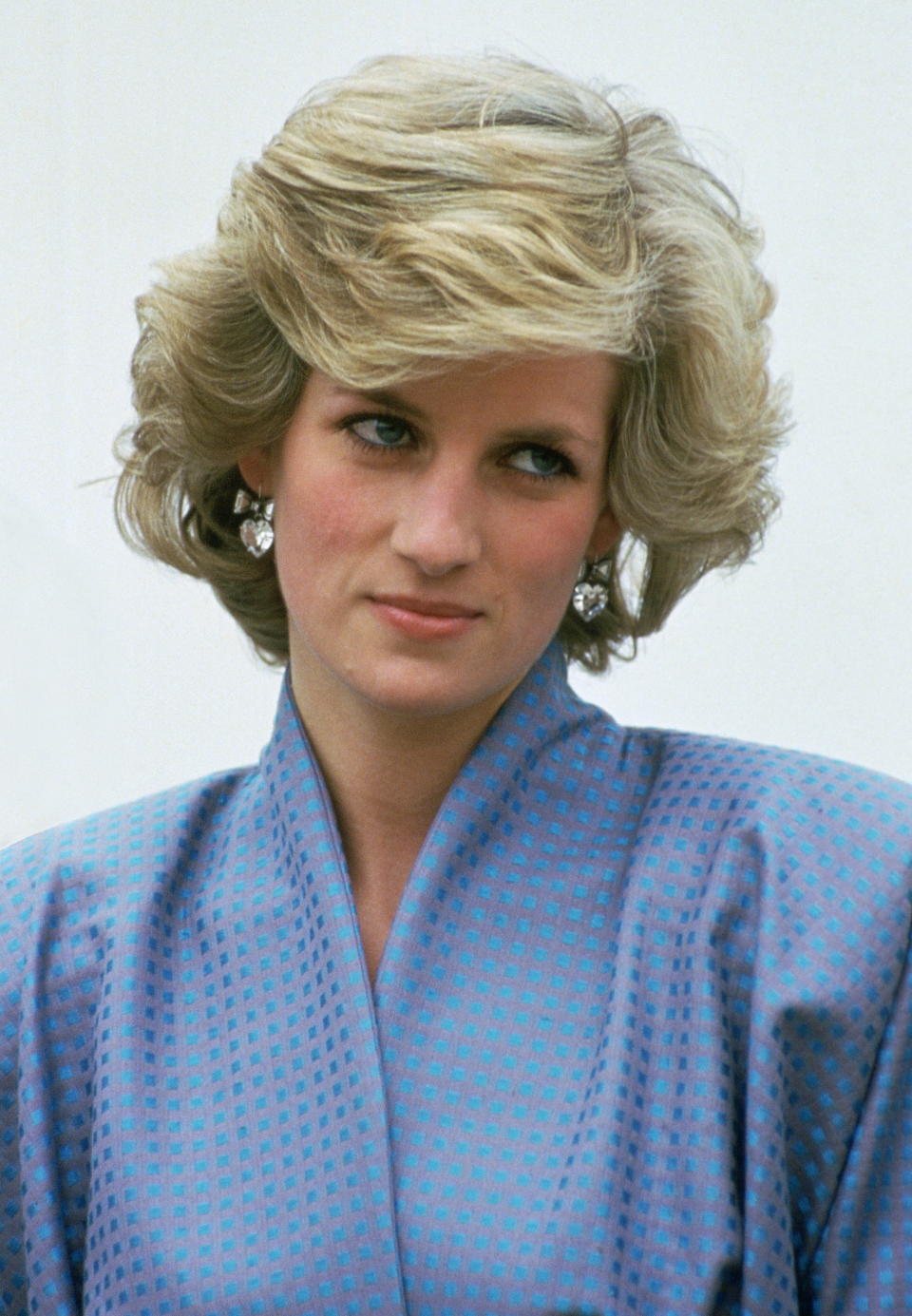 ITALY - APRIL 22:  Diana, Princess Of Wales, Wearing A Silk Suit Designed By Fashion Designer Bruce Oldfield, During An Official Overseas Visit. Diana's Crystal Heart Earrings Are By Jewellers Butler And Wilson.  (Photo by Tim Graham Photo Library via Getty Images)