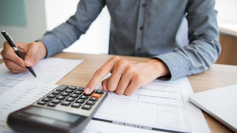 accountant examining financial report.