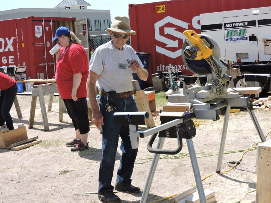 Don Martinson works with other volunteers at the site of a Habitat for Humanity home that was being built several years ago (Active Age photo).