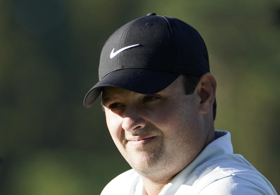 Patrick Reed of the United States watches an amateur golfer's tee shot on the first hole during the pro-am event of the Zozo Championship PGA Tour at Accordia Golf Narashino C.C. in Inzai, east of Tokyo, Japan, Wednesday, Oct. 23, 2019. (AP Photo/Lee Jin-man)