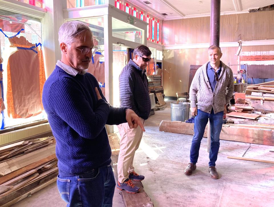 Chris Yermal (left) talks with Brian Wallace (center) and James Goodnight (right) about their current project, renovating the restaurant space at 35 N. Front St. in downtown Wilmington, N.C.