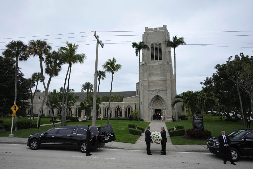 Pallbearers walk with the coffin carrying the remains of Amalija Knavs, mother of former first lady Melania Trump, as they arrive at Church of Bethesda-by-the-Sea for her funeral, in Palm Beach, Fla., Thursday, Jan. 18, 2024. (AP Photo/Rebecca Blackwell)