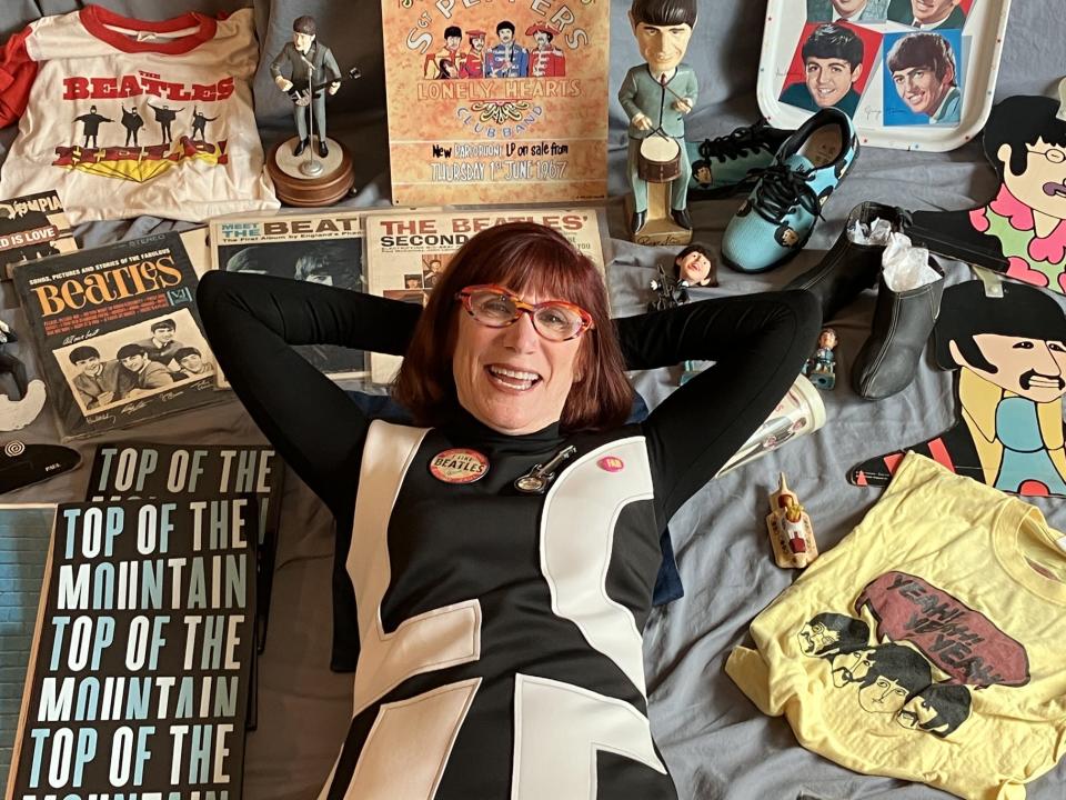 Author Laurie Jacobson surrounded by some of her Beatles memorabilia.