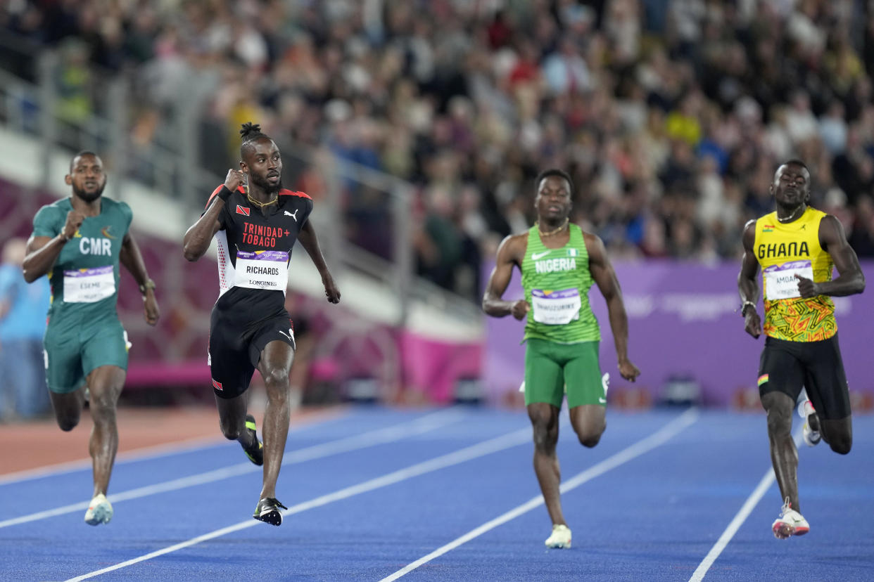 Emmanuel Eseme of Cameroon, Jereem Richards of Trinidad and Tobago, Udodi Chudi Onwuzurike of Nigeria and Paul Amoah of Ghana, from left to right, run in the Men's 200 meters during the athletics competition in the Alexander Stadium at the Commonwealth Games in Birmingham, England, Saturday, Aug. 6, 2022. (AP Photo/Manish Swarup)