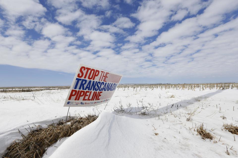 FILE - In this March 11, 2013, file photo, a sign reading "Stop the Transcanada Pipeline" stands in a field near Bradshaw, Neb. The proposed Keystone XL pipeline will run through this field. In a move that disappointed environmental groups and cheered the oil industry, the Obama administration on Jan. 31, 2014, said it had no major environmental objections to the proposed Keystone XL oil pipeline from Canada. (AP Photo/Nati Harnik)