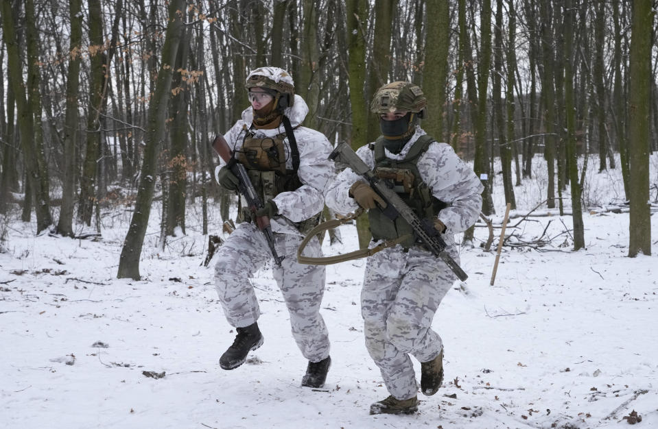 Members of Ukraine's Territorial Defense Forces, volunteer military units of the Armed Forces, train in a city park in Kyiv, Ukraine, Saturday, Jan. 22, 2022. Dozens of civilians have been joining Ukraine's army reserves in recent weeks amid fears about Russian invasion. (AP Photo/Efrem Lukatsky)