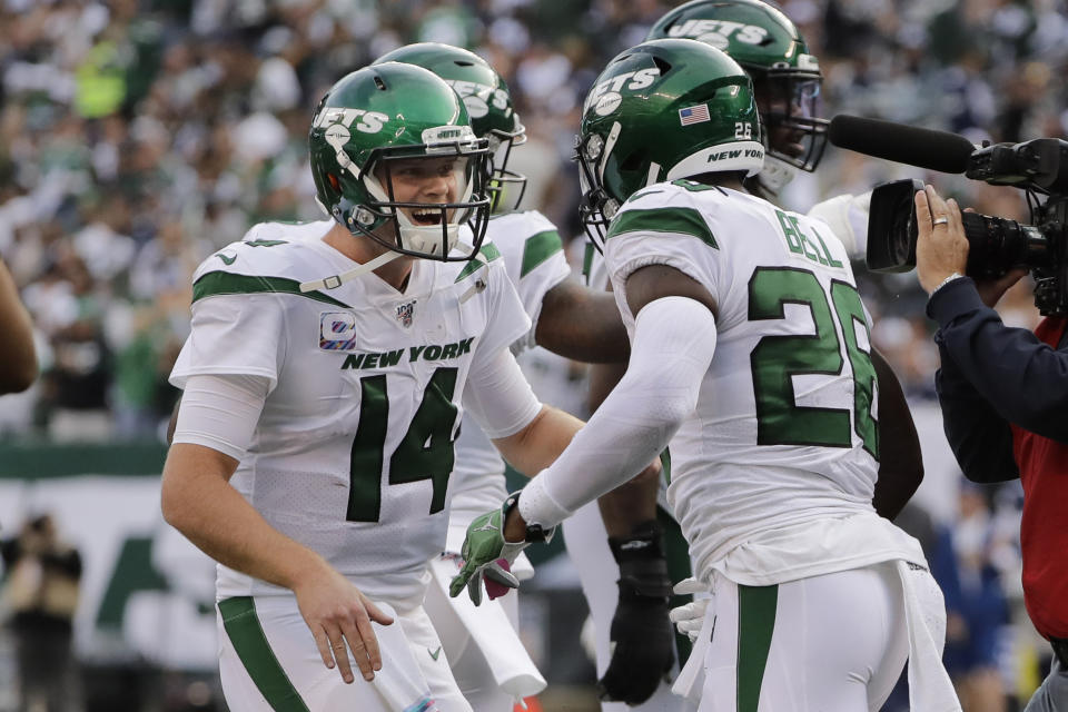 New York Jets quarterback Sam Darnold, left, celebrates with Le'Veon Bell after Bell scored a touchdown during the first half of an NFL football game against the Dallas Cowboys, Sunday, Oct. 13, 2019, in East Rutherford, N.J. (AP Photo/Frank Franklin II)