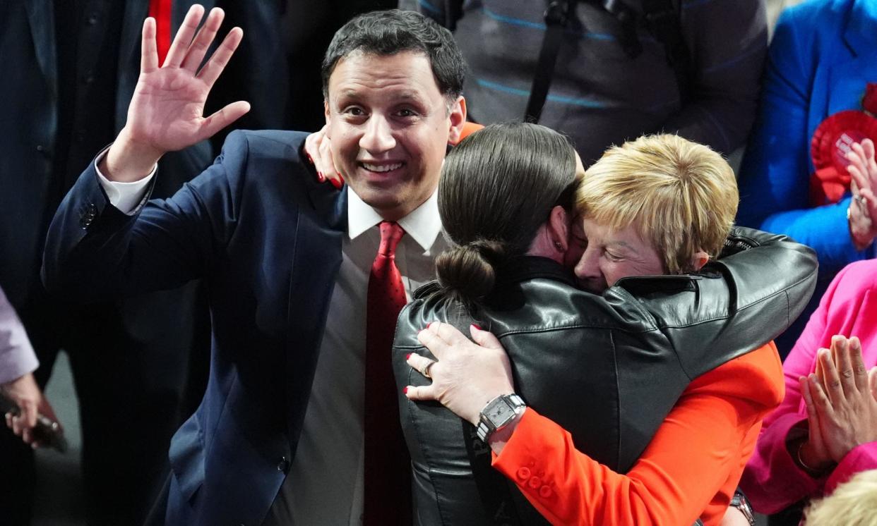 <span>The Scottish Labour leader, Anas Sarwar, celebrates with Maureen Burke (in red) after she is declared the winner of the Glasgow North East constituency.</span><span>Photograph: Andrew Milligan/PA</span>