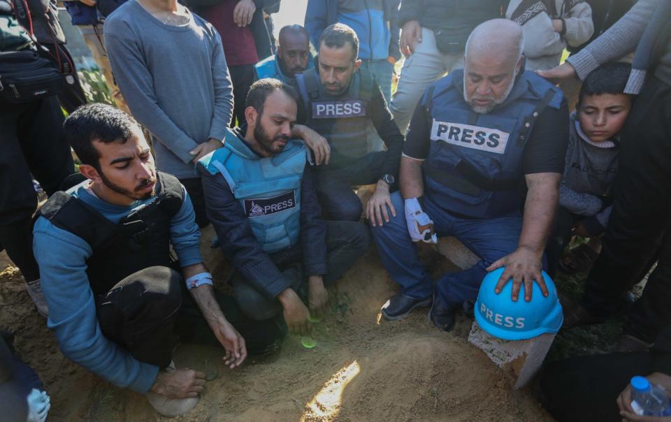 Family and friends bid farewell to the bodies of journalists Hamza al-Dahdouh and Mustafa Thuraya on Jan 7