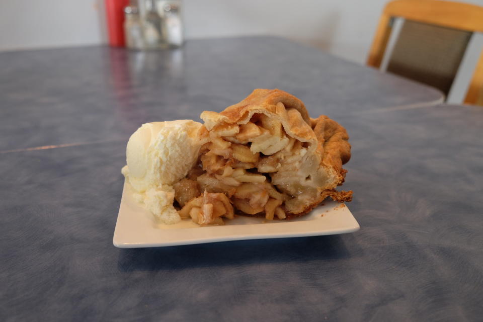 Slice of apple pie with vanilla ice cream at Mom's Café in Sooke, BC