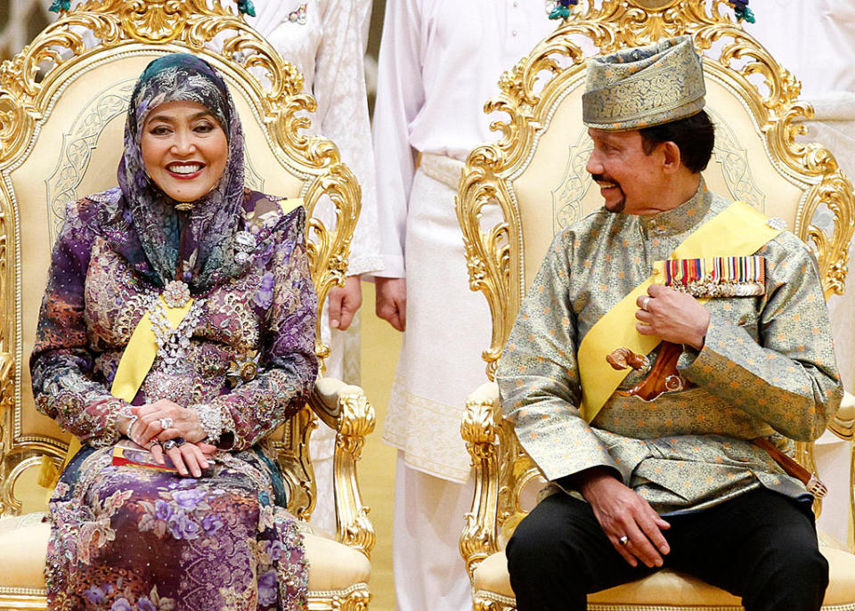 <div class="caption-credit"> Photo by: Wenn.com</div>The Sultan and his wife look happy. With 12 children from three wives and at least one already married, the Sultan, 66, may be looking forward to a day when he'll be done hosting weddings. This week's affair, despite being by no means budget, did away with a traditional procession through the capital in an open gilded Rolls Royce that was costly in terms of crowd control and security. <br>